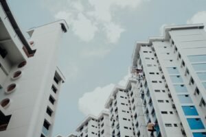 low-angle photo of white building under white sky