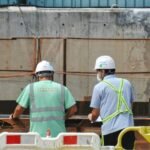 a few men wearing hardhats